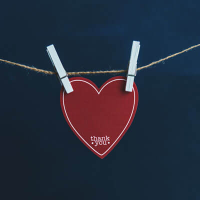 Paper heart hanging on string