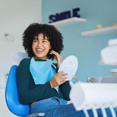 woman with a beautiful smile in a dentist's chair