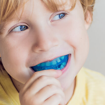 kid wearing sports mouthguard