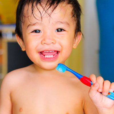 Toddler brushing his teeth