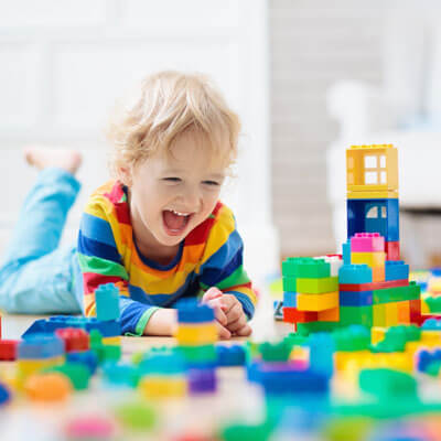 Child playing with colorful blocks