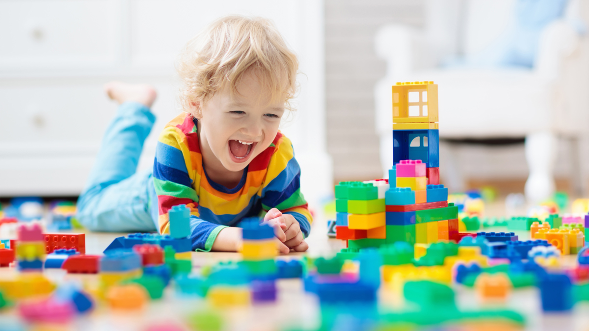 little boy playing with blocks