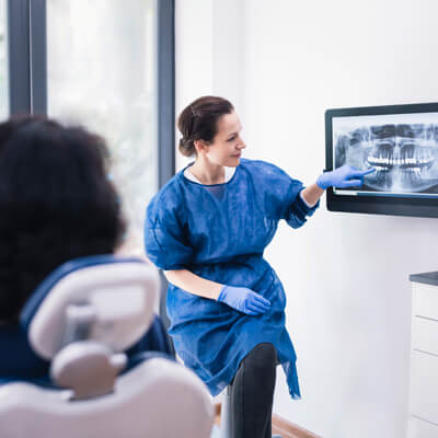 Dentist showing patient an xray
