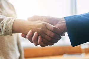 Man and woman shaking hands