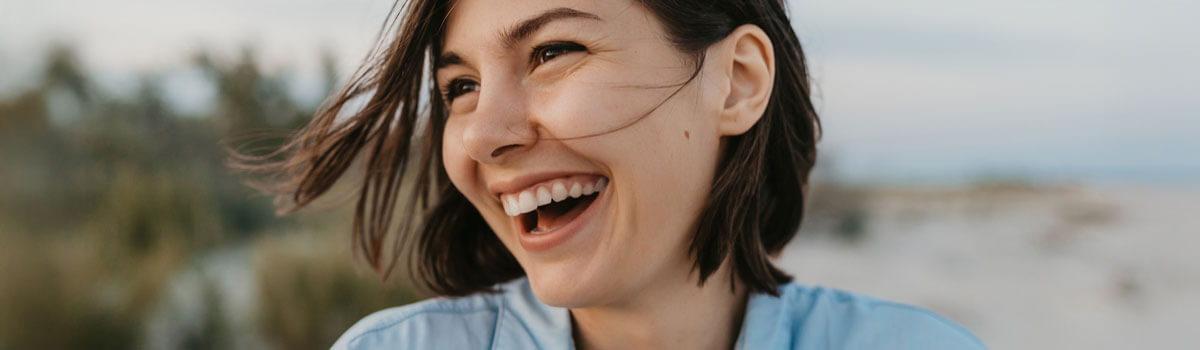 woman smiling at beach