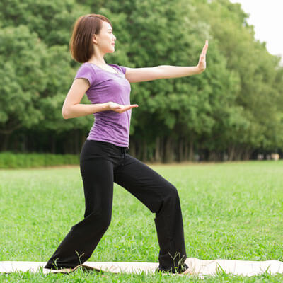 woman doing tai-chi outdoor