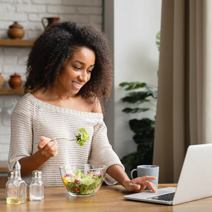 person reading at computer