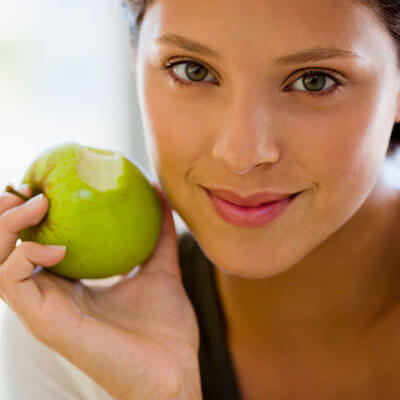 Woman eating an apple