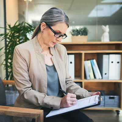 Woman completing paperwork