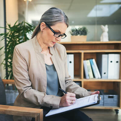 woman completing paperwork