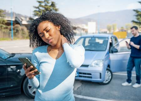 Woman with neck pain after car accident