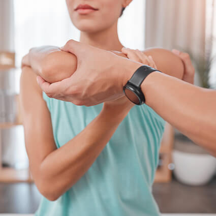 Woman getting arm adjusted