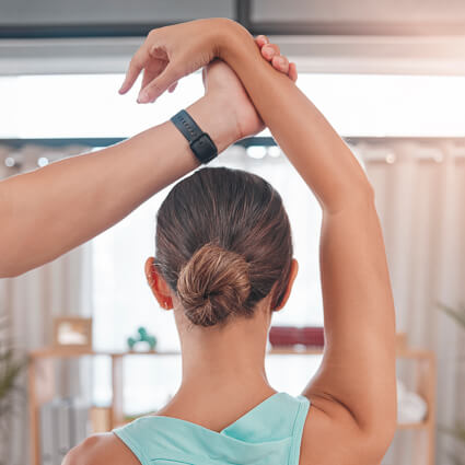 Stretching woman's arm