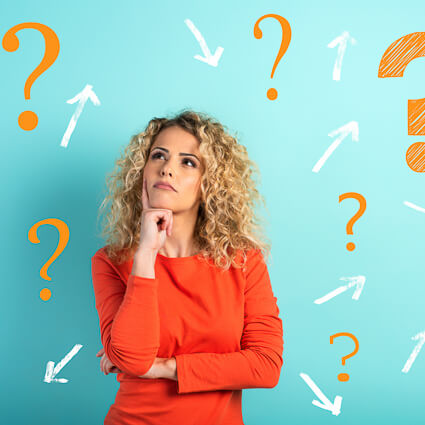woman looking up with question marks