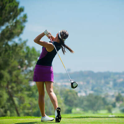 Woman golfing