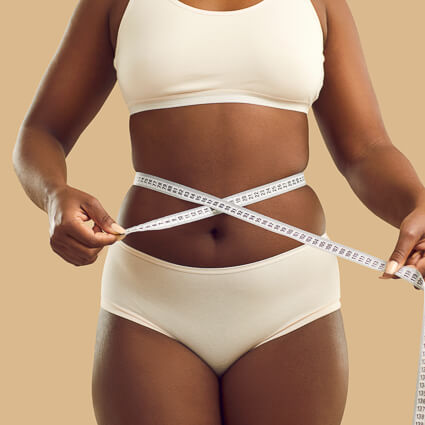 woman with measuring tape around waist