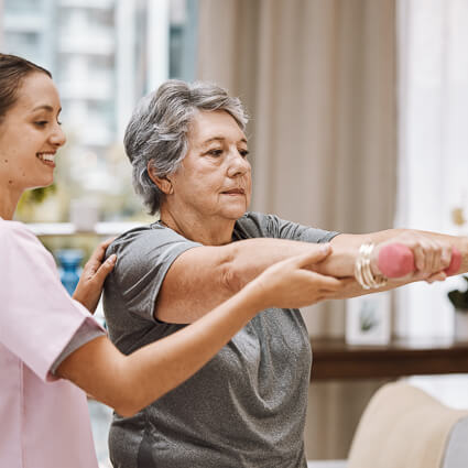 Woman lifting weights during therapy