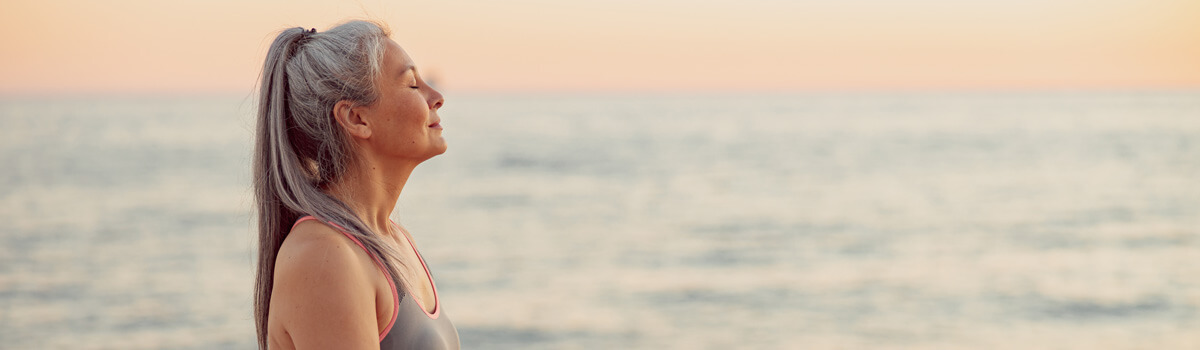 Peaceful looking woman at the beach