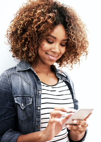 woman looking down and texting