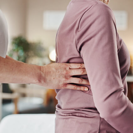 person having their back adjusted