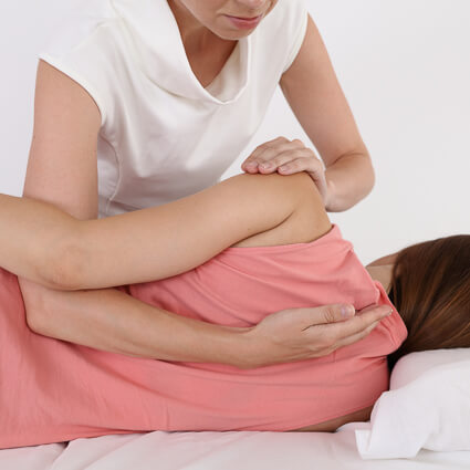 Adjusting woman's back