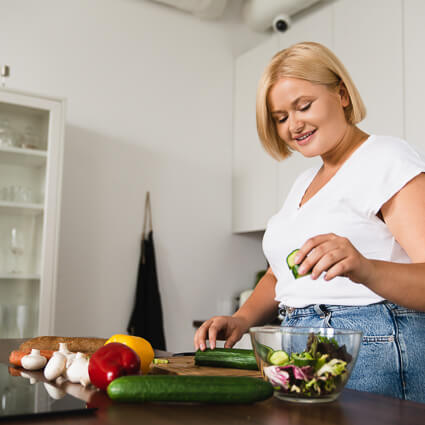 Woman cooking with vegetables
