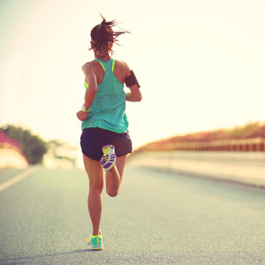 Woman running down a road