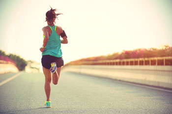 woman running down road