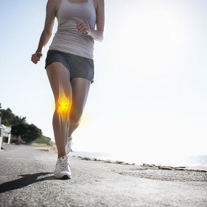 woman running outdoors with knee pain
