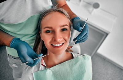 Woman looking up from dental chair