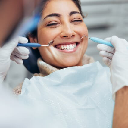 woman smiling in dental chair