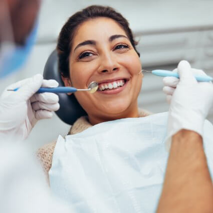 patient smiling during dental exam