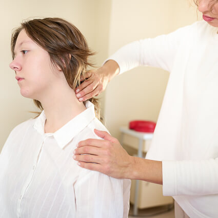Woman white button up having neck adjusted