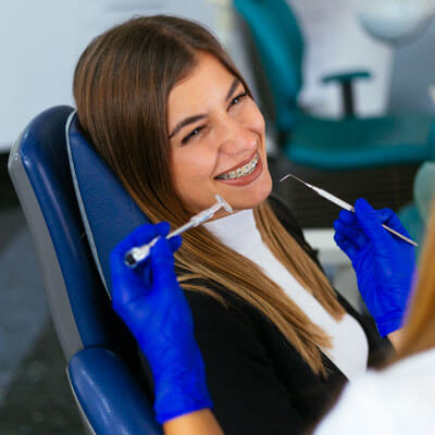 woman with braces at dentist