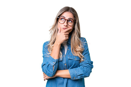 woman looking up with hand on chin