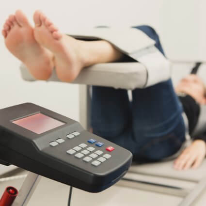 person laying on spinal decompression table