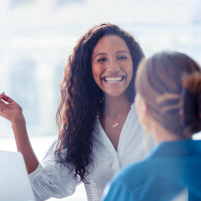 smiling person walking in to office