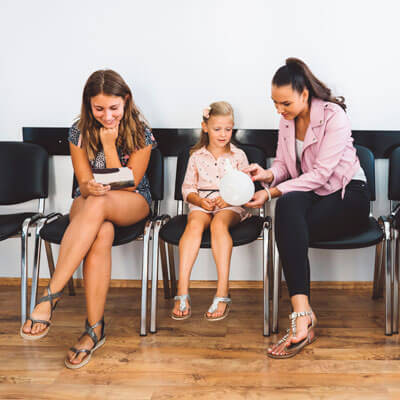 family sitting in a waiting room