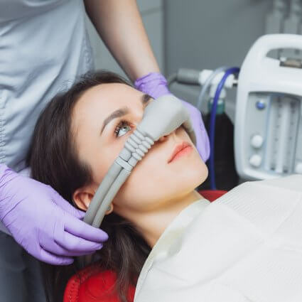 woman with sedation mask over nose