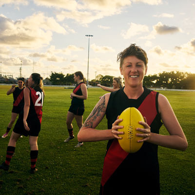 Woman holding rugby ball