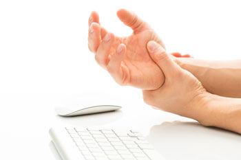 Person's hands in pain due to carpal tunnel