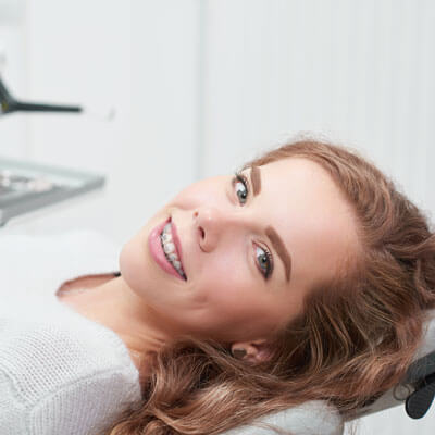 Woman with braces in dental chair