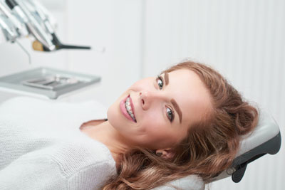 Young woman with braces at dentist