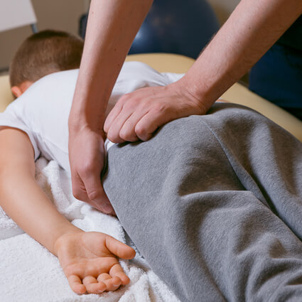 kid having back adjusted