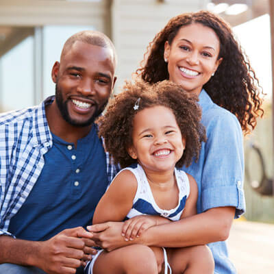 family smiling and hugging