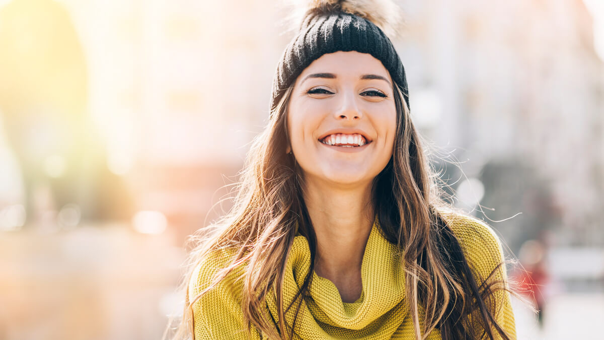 young woman in yellow sweater