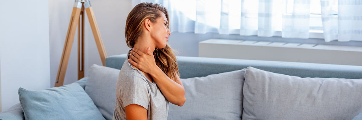 Woman holding neck