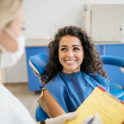 person talking with dentist