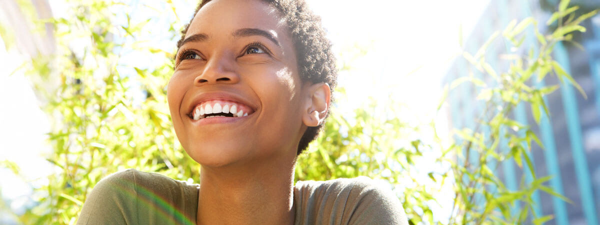 smiling woman looking upwards