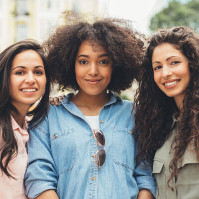 three smiling friends